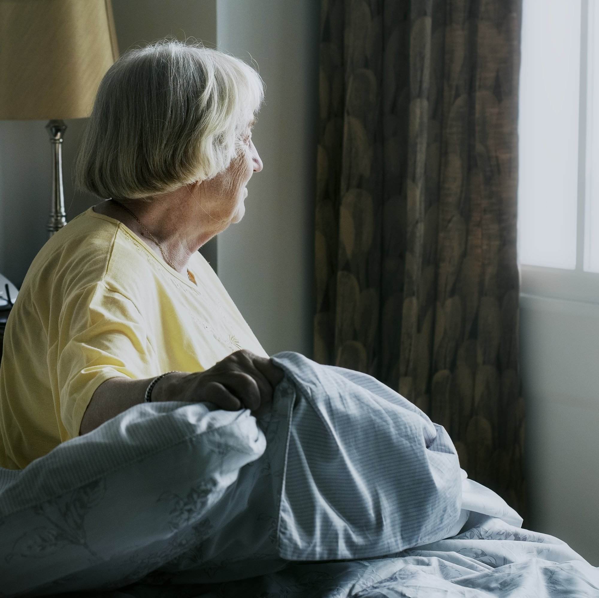 Senior woman sitting in a bedroom Arista_Home_Care_Solutions_in-home_senior_care_home_health_care_toledo_ohio