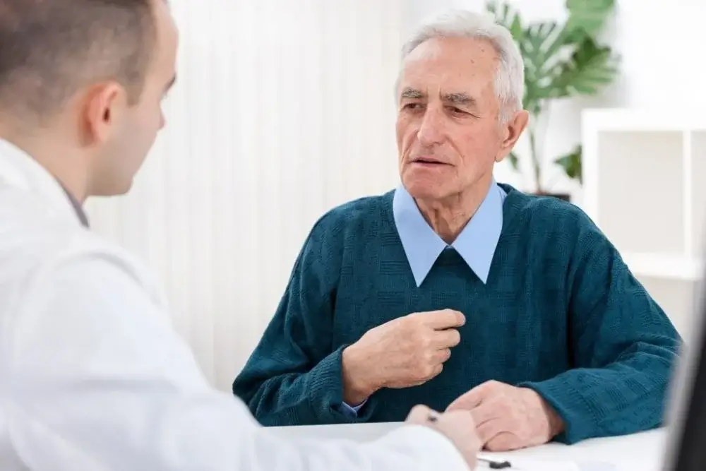 Older adult discussing memory and thinking changes with a physician